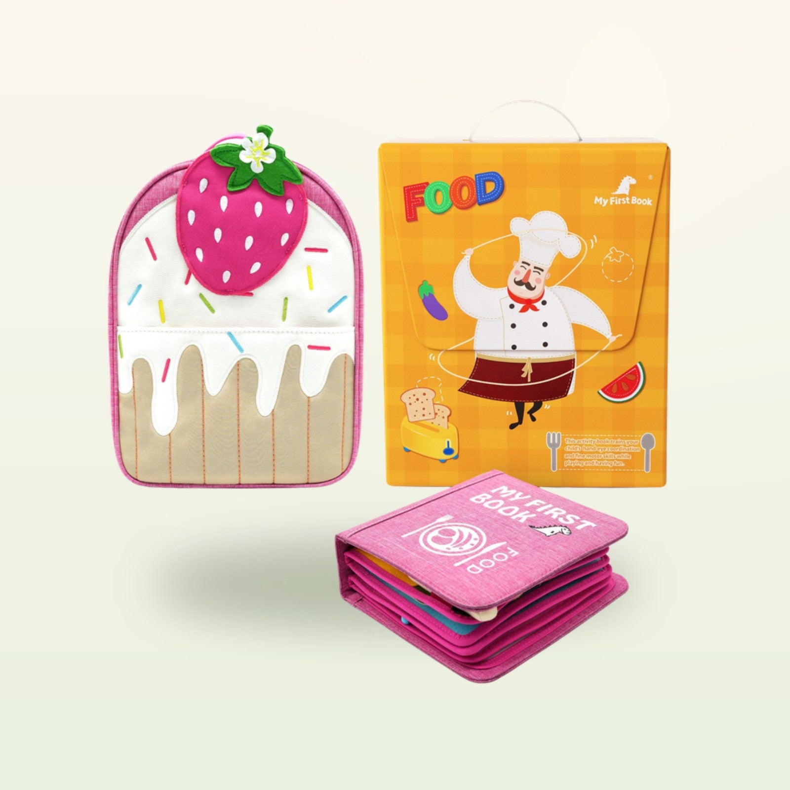 Kleine Feinschmecker Montessori Quiet Book mit Erdbeer-Rucksack und Verpackung auf sanftem Creme-Hintergrund – ab 1 Jahr